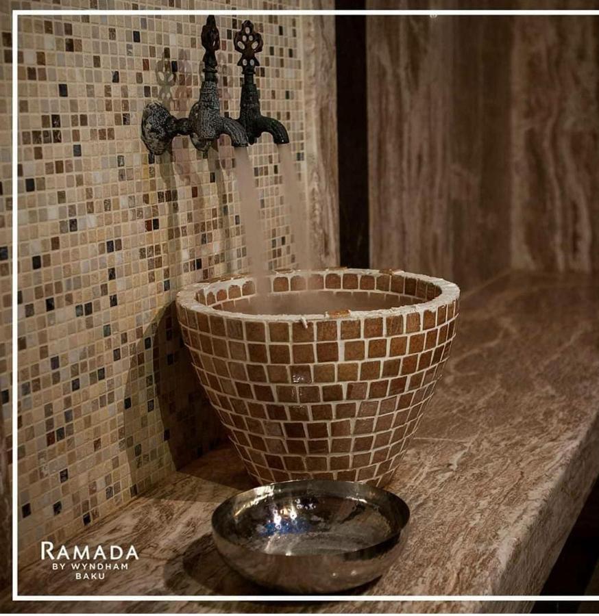Отель Ramada By Wyndham Баку Экстерьер фото A modern handwashing basin
